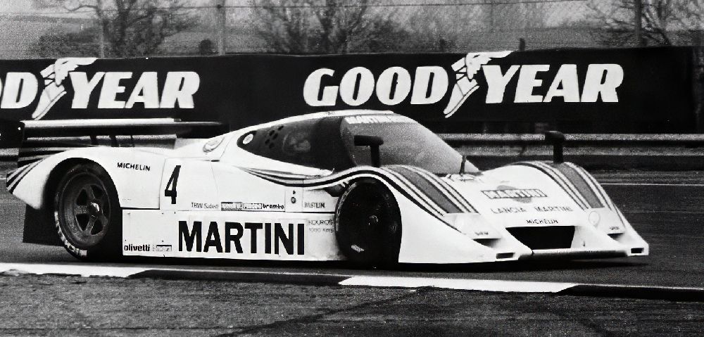 Martini Lancia number 4 passing Goodyear banners at Silverstone