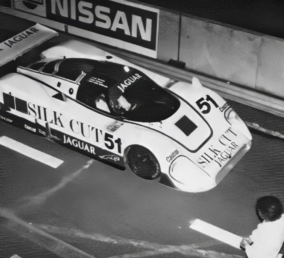XJR-6 number 51 overhead view making a scheduled pit stop at night