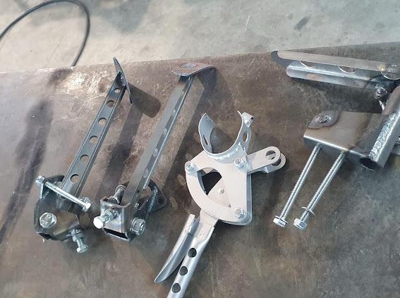 Fabricated brackets, adjusters and mountings