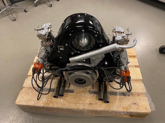 Air-cooled engine with twin carburettors on a workshop stand
