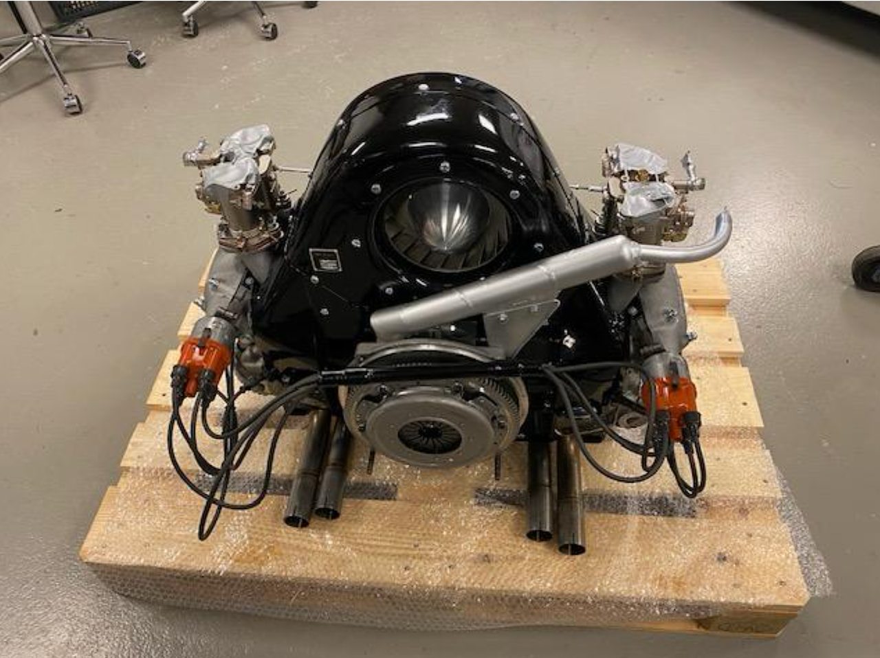 The finished four-cam engine on a workshop stand at the specialist's shop