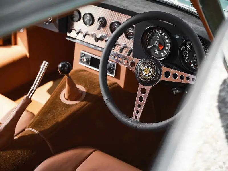 E-Type Re-Imagined — cockpit with toggle switches and three-spoke steering wheel