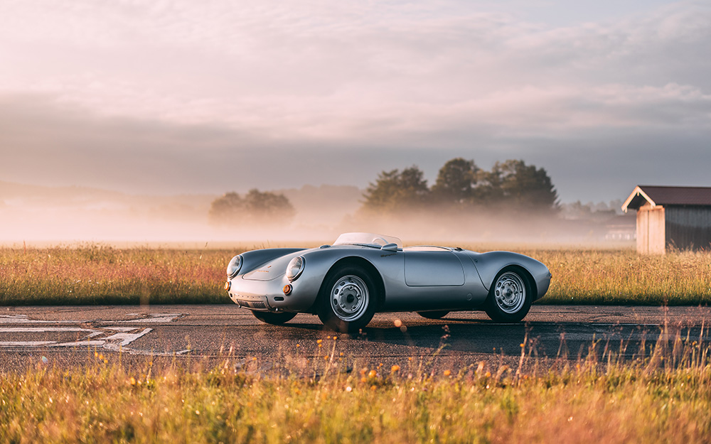 A period 550 Spyder on a misty road at dawn